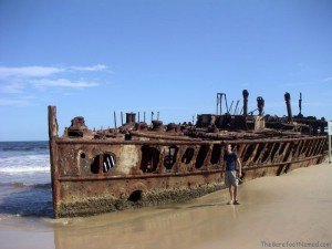 Charles by the rusting Maheno shipwreck Fraser Island Australia sand island