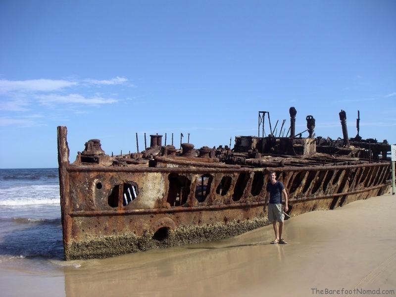 Charles by the rusting Maheno shipwreck Charles by the rusting Maheno shipwreck Fraser Island Australia sand island