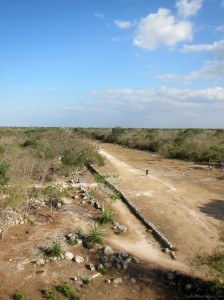Long dusty walk to temple of the dolls Dzibilchaltun