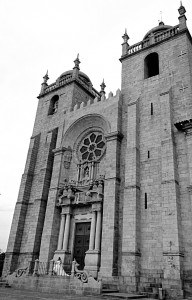 Bride on steps of Cathedral Se Porto Portugal black and white