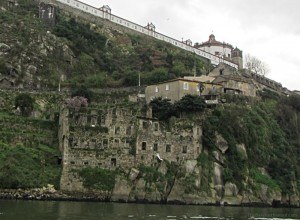 Crumbling ruins on the banks of the Douro River Porto Portugal