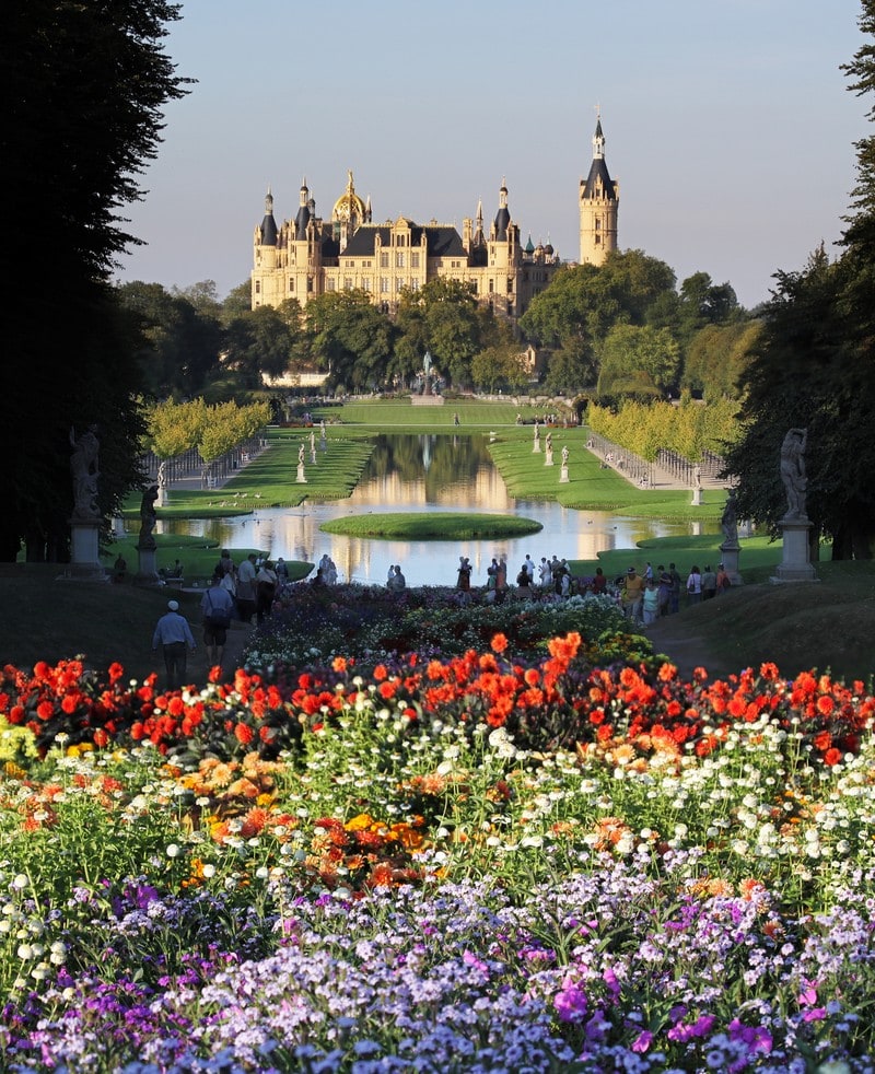 Castle Schwerin Germany across a bed of flowers