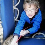 Child helping with the ropes hot air balloon