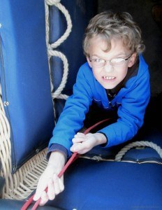 Child helping with the ropes hot air balloon
