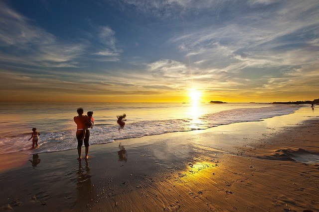Children at the beach by Eric