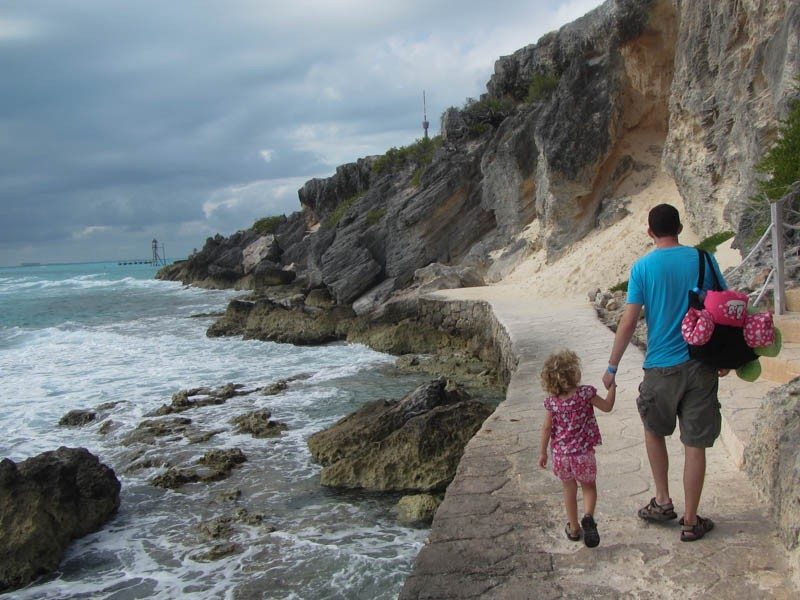 Daddy and Little Girl Walking by Ocean in Mexico