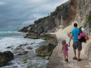 Little Girl and Dad Walking by the Sea
