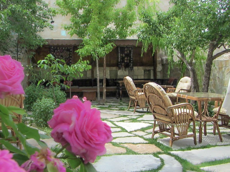 Elysee Cave Hotel Courtyard Roses in Foreground