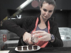 Pouring Ginjinha into chocolate cups Lisbon Portugal