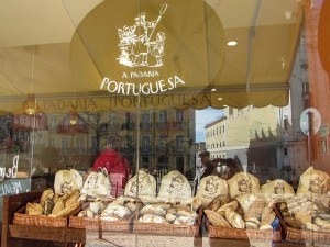 Peeking into Padaria Portuguesa window Lisbon Portugal