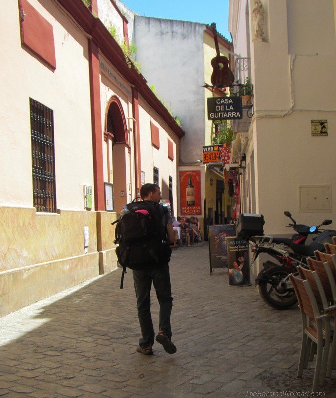 Charles walking by Casa de la Guitarra in Seville