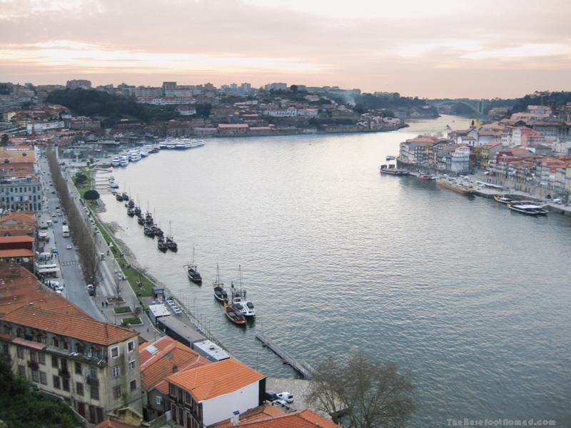 Boats lined up along Av. Diogo Leite on the Douro River in Porto, Portugal
