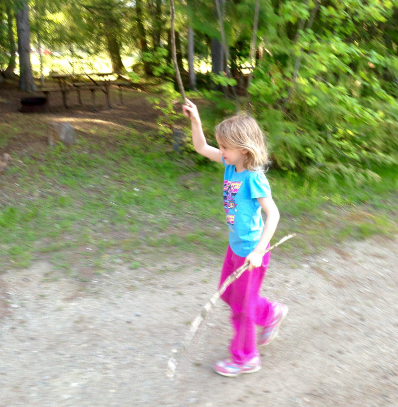 Playing with sticks in the forest Sicamous KOA