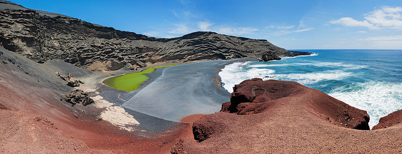 Panorama View of Charco de los Clickos with it's green water, red rock and black sand