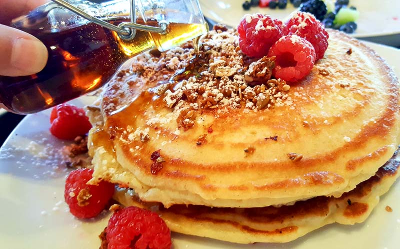 OAK Long Bar + Kitchen pancakes with syrup pecan and raspberry