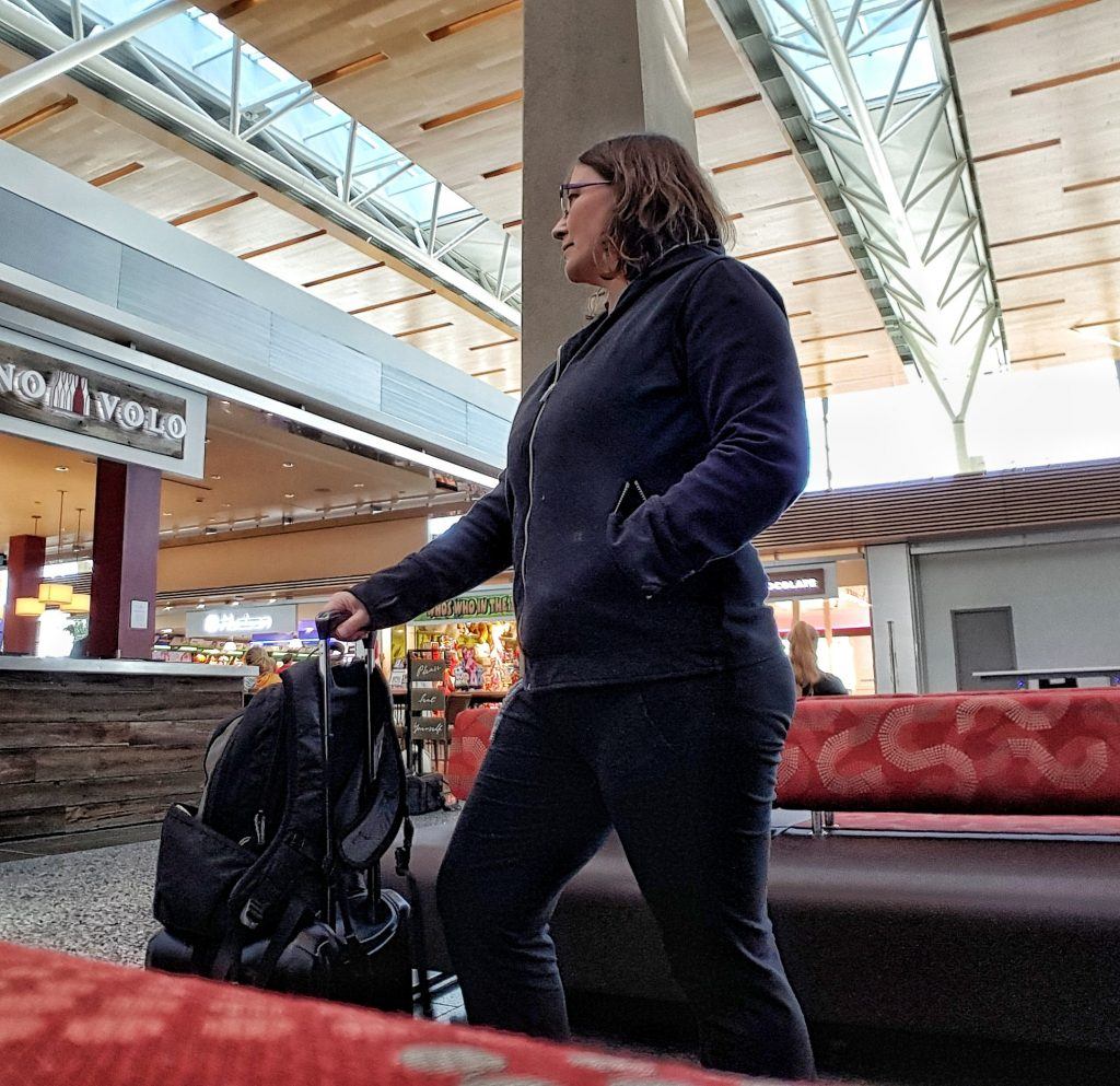 stay safe and organized as a solo traveler Micki of The Barefoot Nomad Travel site in Calgary airport