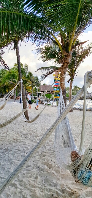 Hammocks white sand and the lagoon at Xcaret