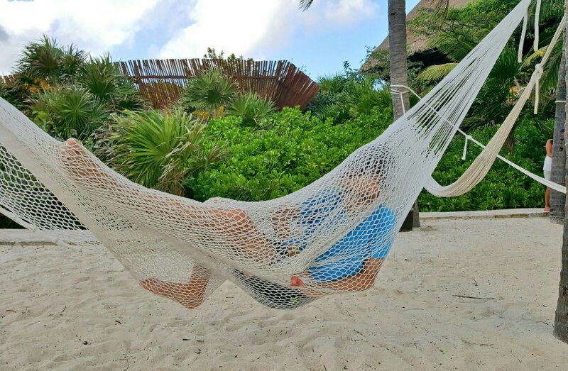 Xcaret kid playing in hammock