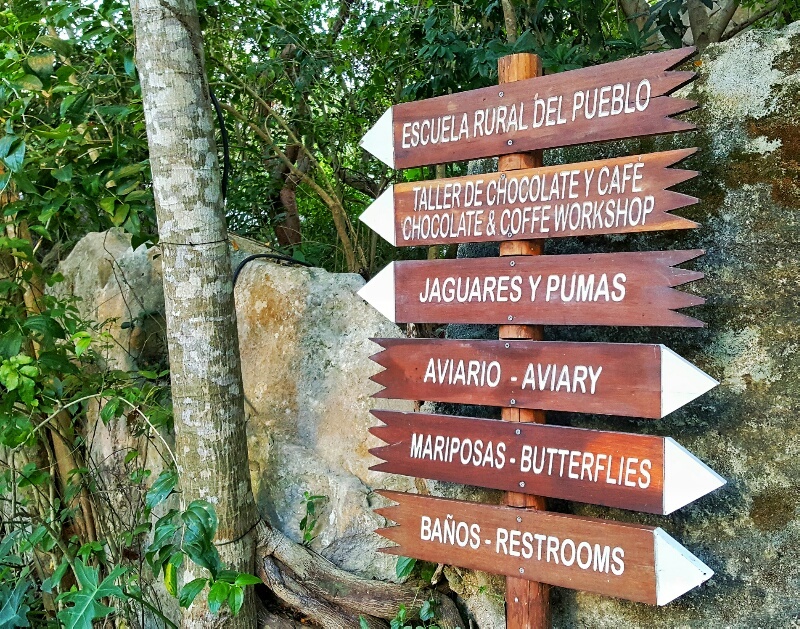 Xcaret sign aviary jaguars butterflies school and town