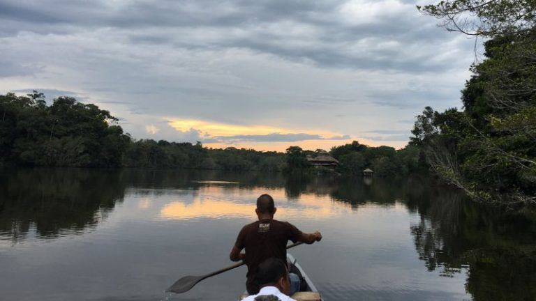 Canoeing Into The La Selva Lodge In The Ecuadorian Amazon
