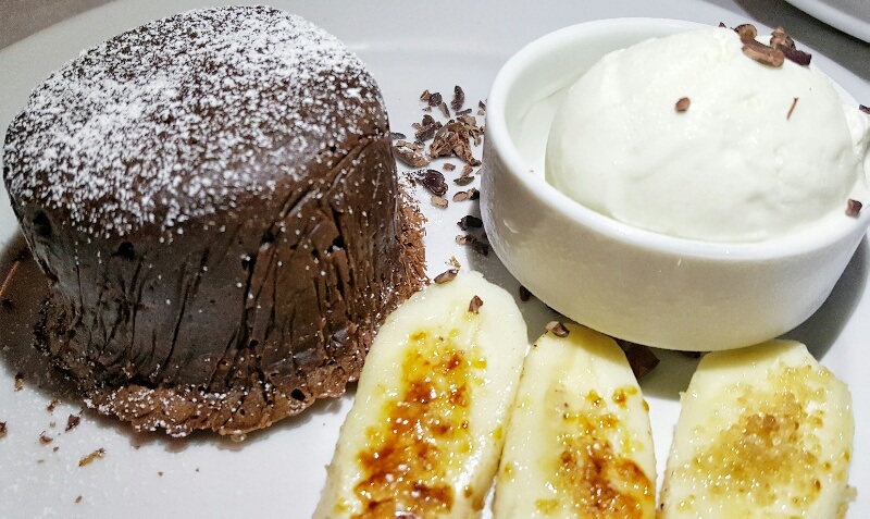 Savoring desserts bananas with chocolate lava cake Victoria House Belize