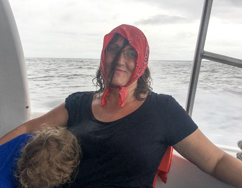 Micki soaking wet on ferry to Santa Cruz Galapagos