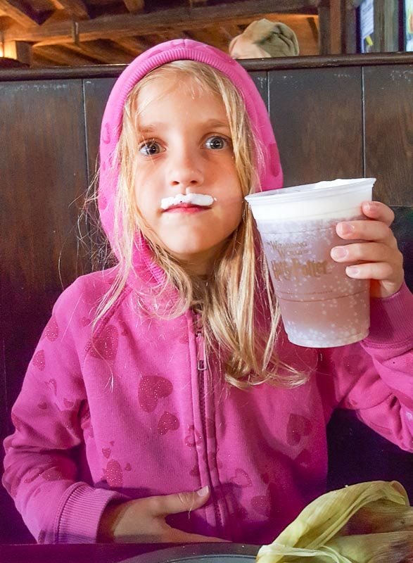 The Wizarding World of Harry Potter girl with butter beer moustache