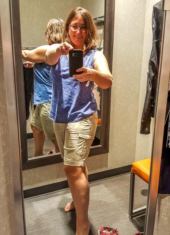 Happy in the fitting room trying on Marks casual clothing