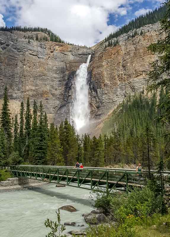 Walking across the bridge at Takakkaw Falls