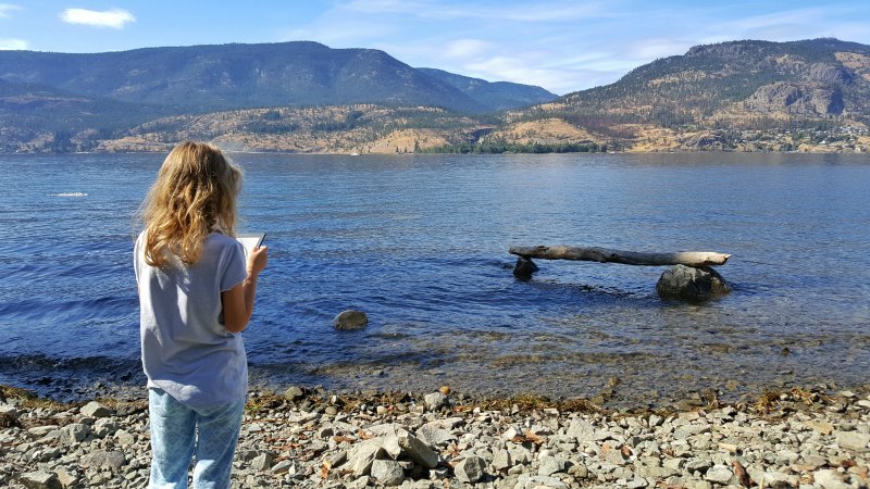 reading the Kindle by the lake