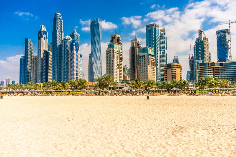 Dubai white sand beaches and skyscrapers in the distance