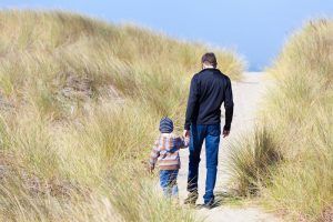 Oregon Dunes boy and dad walking