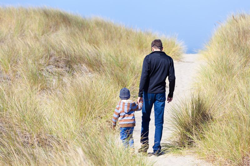 Oregon Dunes boy and dad walking
