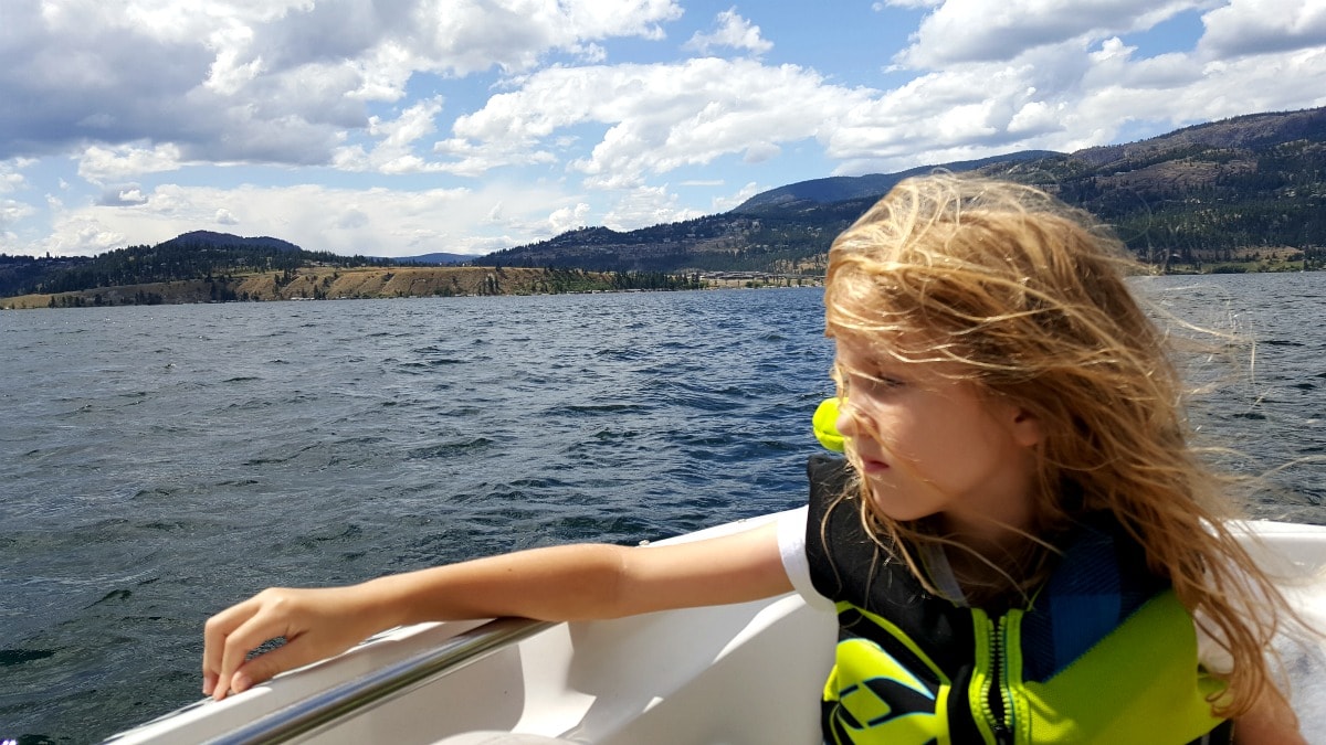 Girl on a boat lake Okanagan 