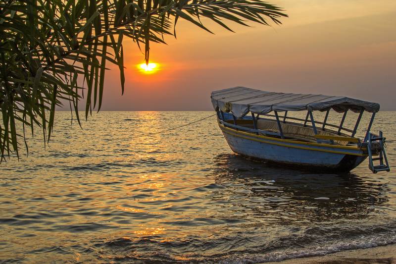 moored boat at sunset Lake Victoria Tanzania