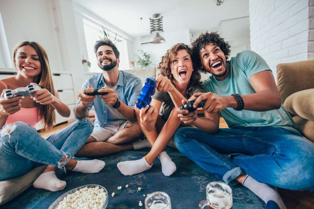 Group of friends playing video games together Dp