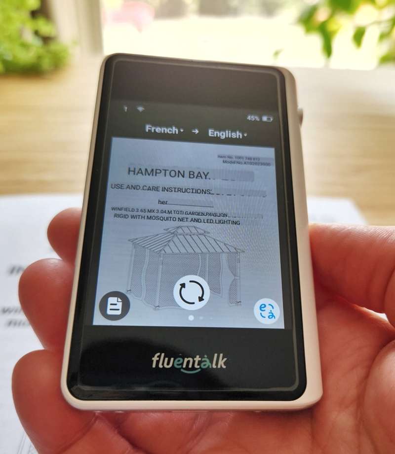 Photo translation of French to English Fluentalk T1 Mini Handheld Translator