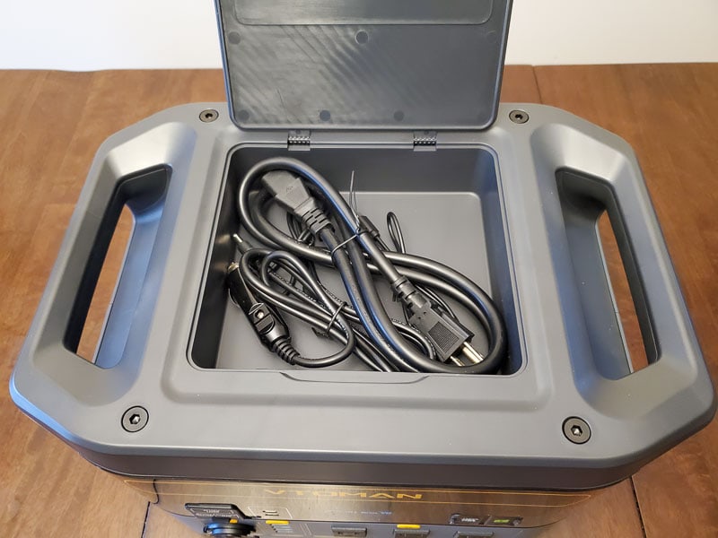 Storage cubby and cables showing the top of the VTOMAN FlashSpeed 1500 portable power station