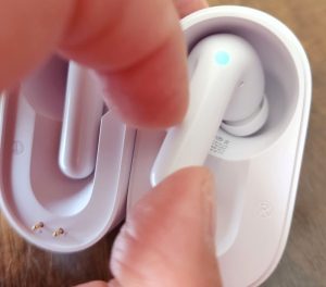 Taking the Fluentalk Timekettle M3 earbuds out of the charging case