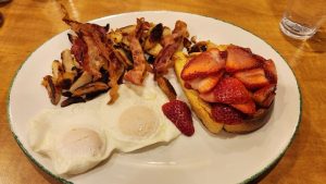 Cora Kelowna eggs bacon hash browns French Toast with fresh strawberries