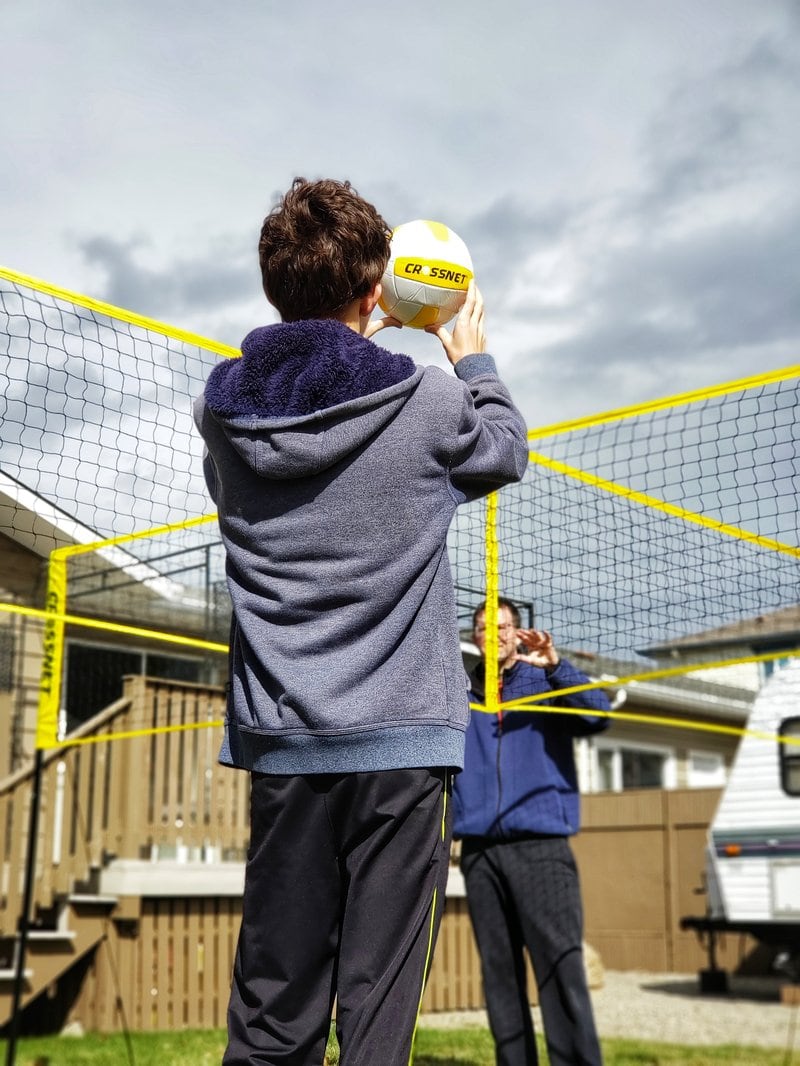 father and son playing CROSSNET