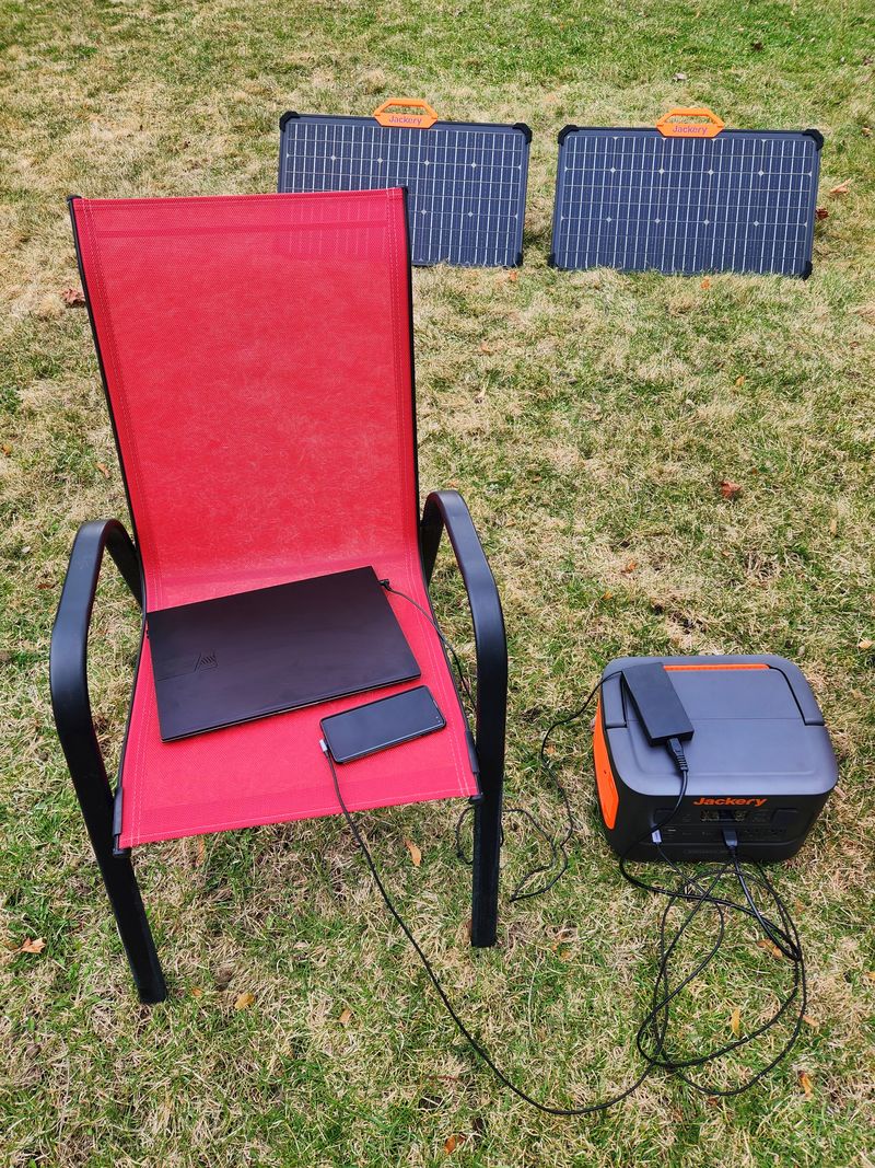 Jackery Explorer 1000 Pro used to charge laptop and phone at the same time.
