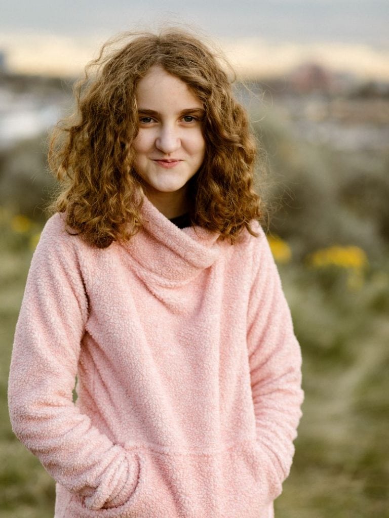 Flytographer photo girl in a pink sweater