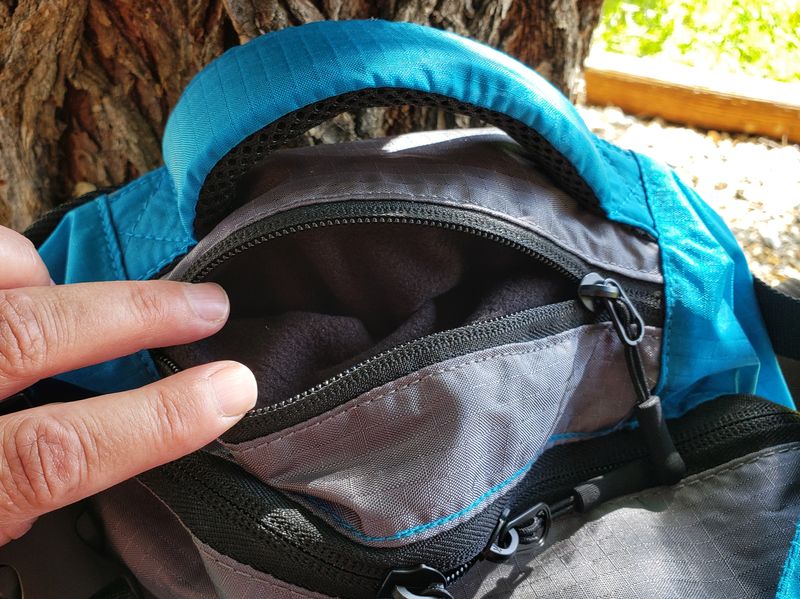 small pocket for wallet or passport at top of Twin Lakes Paxis backpack