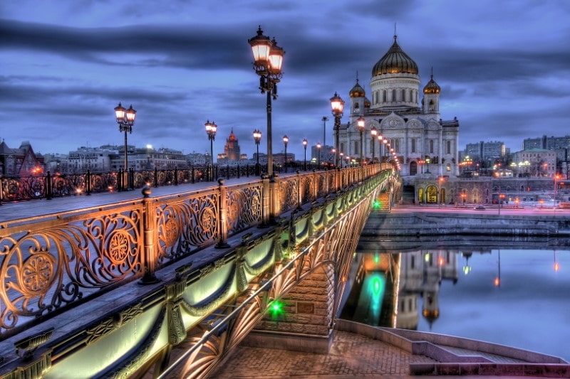 Beautifully lit and intricate bridge leading to the Cathedral of Christ the Saviour church in Moscow, Russia