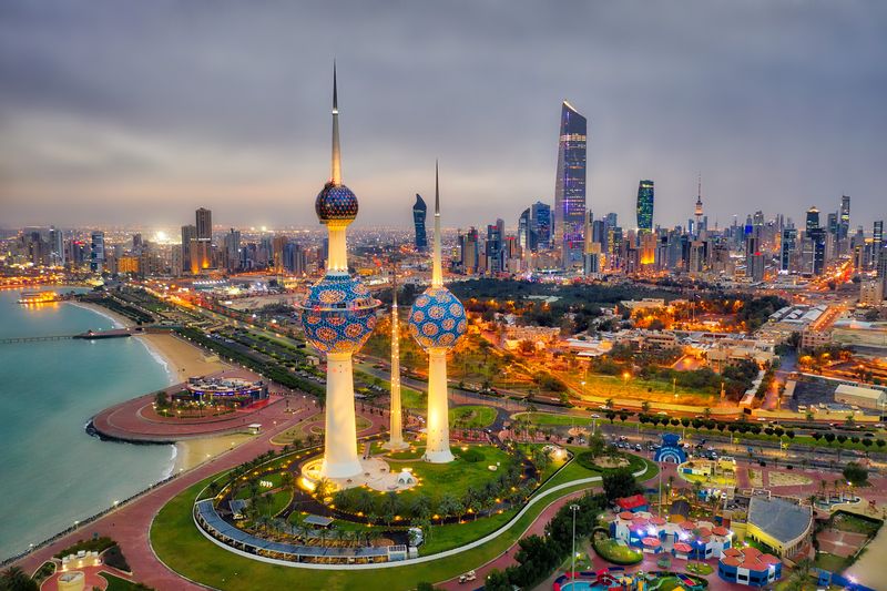 Places to visit in Kuwait, with Kuwait Tower City Skyline glowing at night