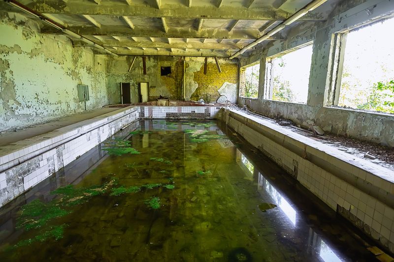 Abandoned school swimming pool in ghost town Pripyat DP