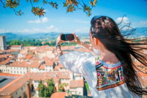 woman using a cell phone as a camera in Europe