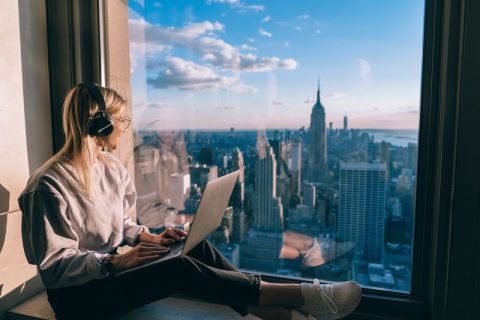 Cybersecurity tips for travelers digital nomad in headphones DP