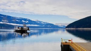 Ferry boat on blue lake near Nakusp BC